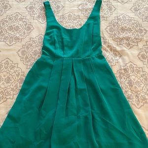 Emerald dress with open back and tie waist